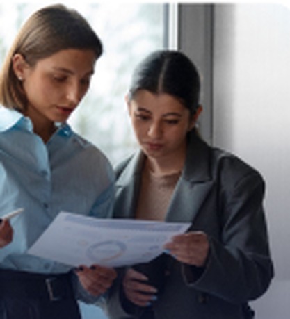 Two colleagues reviewing a report